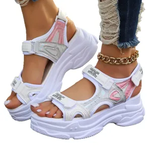 Stylish women's white chunky platform Roman sandals with iridescent pink accents for summer.