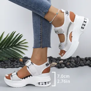 Detail of white platform sports sandals with rhinestones and 7cm heel height measurement