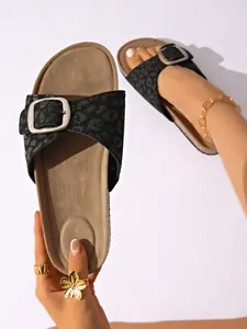 Detailed view of women's leopard print slide sandals with adjustable buckle strap