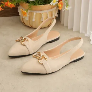 Elegant beige suede pointed-toe flat slingback sandals with gold horsebit buckle detail.