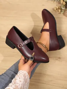 Elegant burgundy Mary Jane loafers with buckle strap and a unique T-strap design