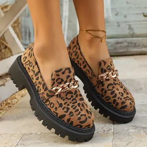 Stylish leopard print chunky loafers with a gold chain detail and thick platform sole.
