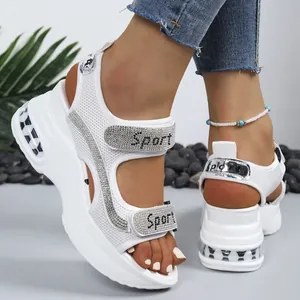 Stylish white platform sandals with rhinestone Sport lettering and Velcro straps
