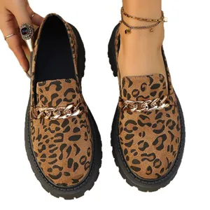 Stylish women's leopard print thick sole loafers featuring decorative gold chains