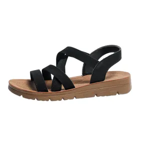 Detailed side profile of women's flat Roman sandals with black elastic cross strap design