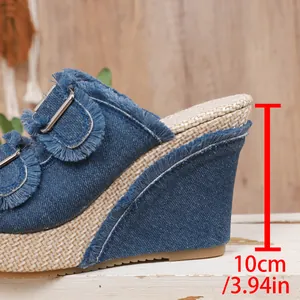 Close-up of a 10cm blue denim wedge heel on thick-sole platform sandals for women