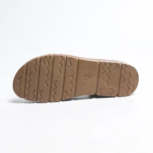 Detailed view of brown sandal sole featuring wavy anti-slip texture and size 37 mark.