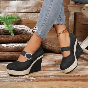 Elegant black denim women's wedge heels featuring buckle straps and woven platform detailing
