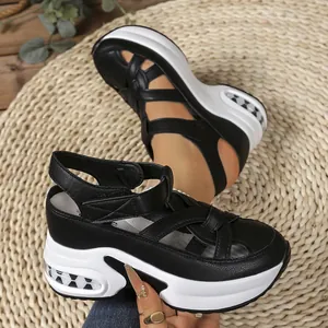 Detail view of black platform sandals with air cushion sole and velcro straps