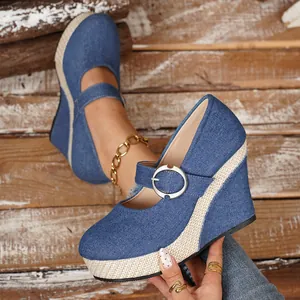 Casual blue denim wedge platform shoes featuring silver buckle and braided jute sole