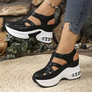 Stylish black platform sandals with Velcro straps and thick white soles for women