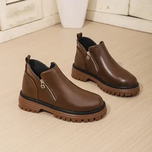High-quality detail view of brown thick-sole Martin boots with stylish gold-tone zipper.