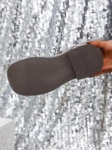 Macro detail of the anti-slip rubber sole on vintage British style square toe boots.
