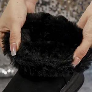 Close-up detail of the thick black plush fur lining inside these warm winter snow boots for women