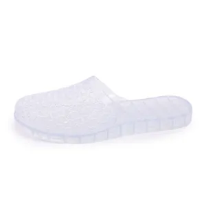 Detailed side view of clear crystal hollow slippers featuring a breathable thick platform sole