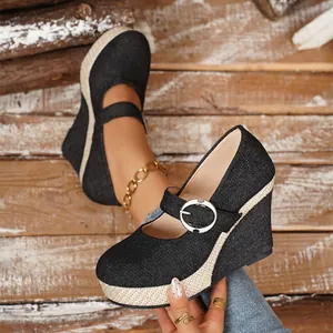 Stylish black denim Mary Jane wedge heels with woven jute platform and buckle.