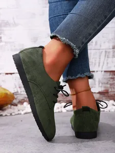 Side view detail of comfortable women's olive green suede lace-up casual shoes
