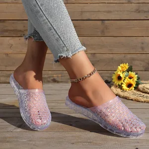 Close-up showing the intricate hollow-out texture of purple glitter crystal jelly slippers