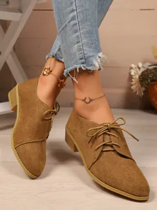 Stylish khaki suede pointed-toe oxford shoes for women with side lace-up detail.