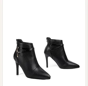 Elegant black pointed-toe high heel ankle boots with rhinestone charm decorative details