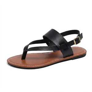 Detail shot of black faux leather flat thong sandals with adjustable ankle strap