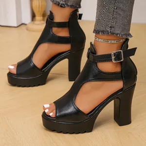 Close-up side view of black chunky high heel platform sandals with ankle buckle straps