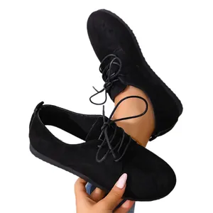 Women's black suede lace-up oxfords with comfortable flat soles and round toe design