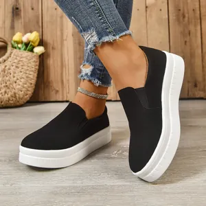Casual women's black suede slip-on leisure sneakers featuring a thick white platform sole