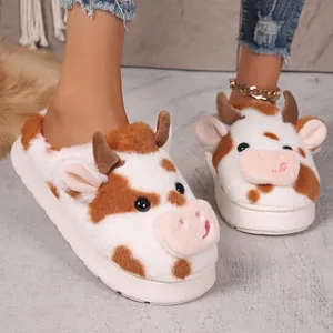 Comfortable cow pattern plush slippers with a thick anti-slip sole for winter home wear.