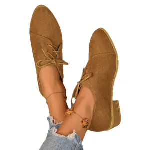 Elegant brown suede pointed-toe flats with stylish side lace-up and low block heels