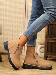 Stylish tan suede ankle boots with side zipper and chunky lug sole for autumn fashion