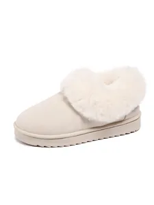 Minimalist cream winter snow boot featuring a plush faux fur collar and thick flat sole