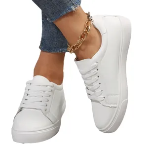 Classic white low-top casual sneakers featuring a secure lace-up design and textured finish.