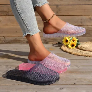 Detail view of breathable hollow-out crystal slippers with thick non-slip soles.