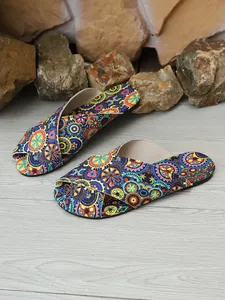 Detailed view of vibrant bohemian floral print crossover flat slides for women's summer