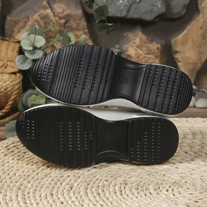 Detail view of black platform sandal outsole with anti-slip grooves and size mark.