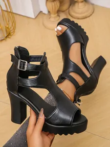 Detailed side view of black platform chunky heel sandals featuring peep toe and ankle strap
