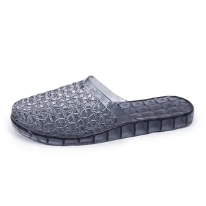 Side view of women's grey translucent mesh jelly slippers with thick non-slip sole