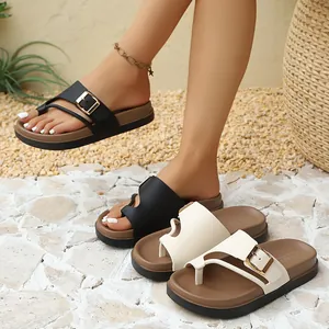 Detailed view of stylish women's platform sandals with adjustable buckle and thong straps.