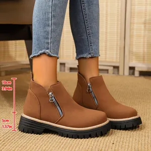 Detailed view of brown suede ankle boots showing 5cm platform and 10cm shaft height