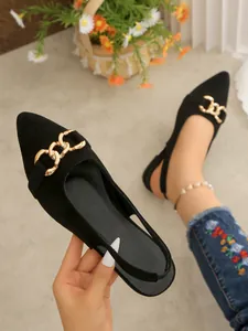 Black pointed-toe flat shoes featuring gold chain detail and elegant slingback strap.