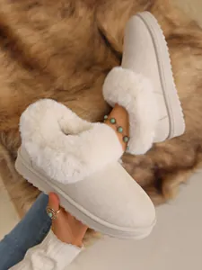 Cozy cream snow boots with thick faux fur collar and anti-slip sole for winter warmth