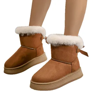Winter women's platform snow boots with white faux fur trim and bow detail