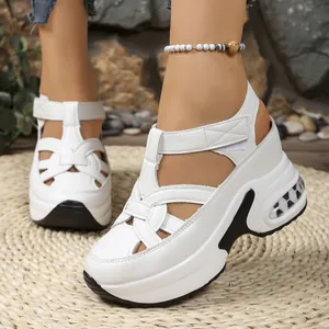 Side view detail of white platform sandals featuring chunky air cushion sole and Velcro straps