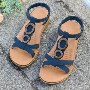Comfortable vintage blue flat sandals for women with elastic straps and wood rings