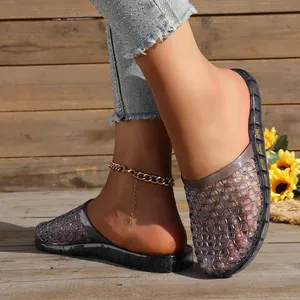Close-up of hollow breathable mesh semi-closed-toe crystal jelly slippers with thick sole