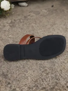 Close-up detail of durable non-slip sole for women's vintage square toe flat sandals