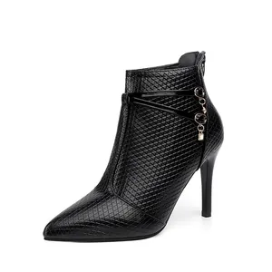 Detailed side view of elegant black textured stiletto ankle boot with rhinestone charm