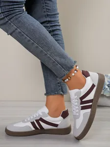 Detail view of women's color block German Army trainers with brown gum sole