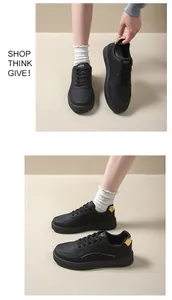 Side and top view of black casual platform sneakers with elegant gold accents for women